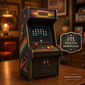 May include: A miniature arcade cabinet featuring a screen displaying a space shooter game, a red joystick, and colourful buttons. The side panels are decorated with orange and blue lightning bolts and stars. Text on the side reads STL DIGITAL DOWNLOAD.