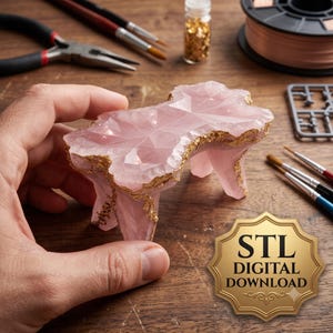 May include: A small, faceted, light pink translucent table-like object with irregular edges accented by gold-colored trim. A gold-colored badge in the bottom right corner features the text STL DIGITAL DOWNLOAD in black lettering.