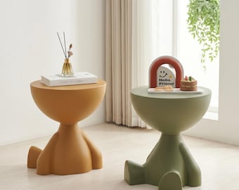 Sculpturale kunststof bijzettafel, modern karakteraccent, speels minimalistisch decor