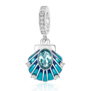 May include: A silver charm in the shape of a seashell featuring a central oval light blue stone, blue and teal enamel detailing, and small clear stones embedded along the bail and the outer edges of the shell, with S925 stamped on the side.