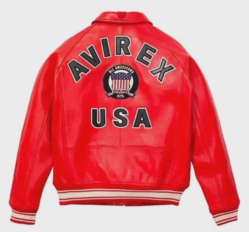 May include: A vibrant red leather jacket with the text "AVIREX" arched across the shoulders and "USA" below a circular emblem. The emblem features a shield with the American flag and the words "ALL AMERICANS ESTABLISHED 1975". The jacket has white and black striped cuffs.