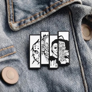 May include: A black and white enamel pin featuring four horror movie characters. The pin is rectangular with a black border and is displayed on a denim jacket. The pin features Jason Voorhees, Freddy Krueger, and Michael Myers.