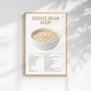 Puede incluir: Un cartel enmarcado con una receta de Sopa de Frijoles del Senado. El título está en color beige sobre un cuenco blanco lleno de sopa. Los ingredientes y las instrucciones se enumeran debajo de la imagen.