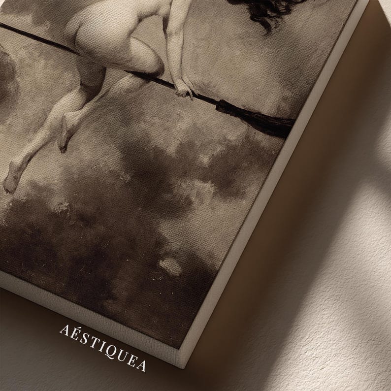 May include: A rectangular canvas print featuring a sepia-toned reproduction of a classical painting depicting a figure flying through a cloudy sky on a broomstick. The word AESTIQUEA is printed in white capital letters at the bottom left corner.