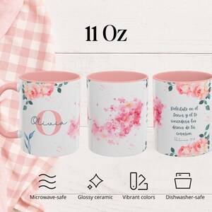 May include: Three white ceramic mugs with pink interiors and handles. Each mug features a floral design with pink roses and green leaves. One mug has the name "Olivia" and the letter "O". The mugs are 11 oz.