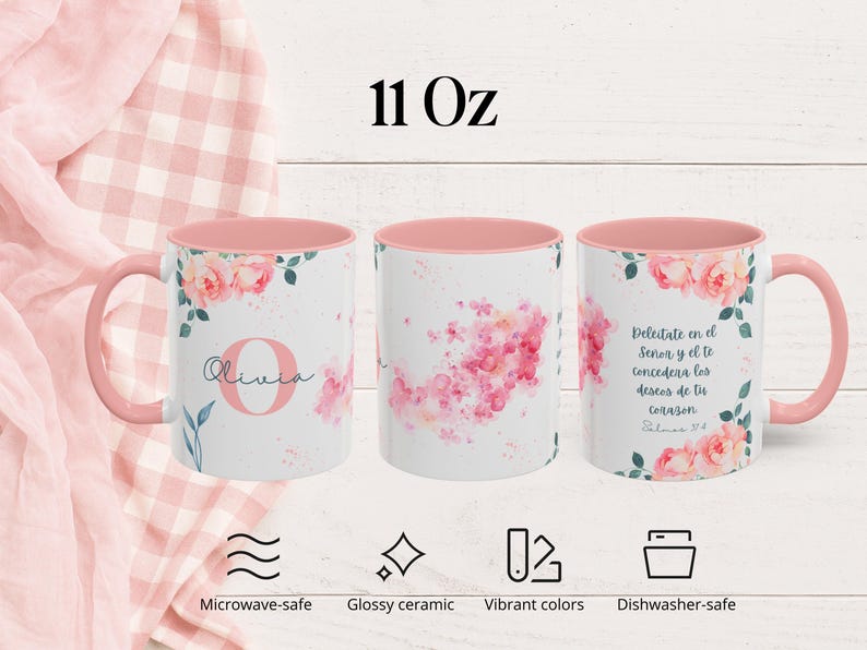 May include: Three white ceramic mugs with pink interiors and handles. Each mug features a floral design with pink roses and green leaves. One mug has the name "Olivia" and the letter "O". The mugs are 11 oz.