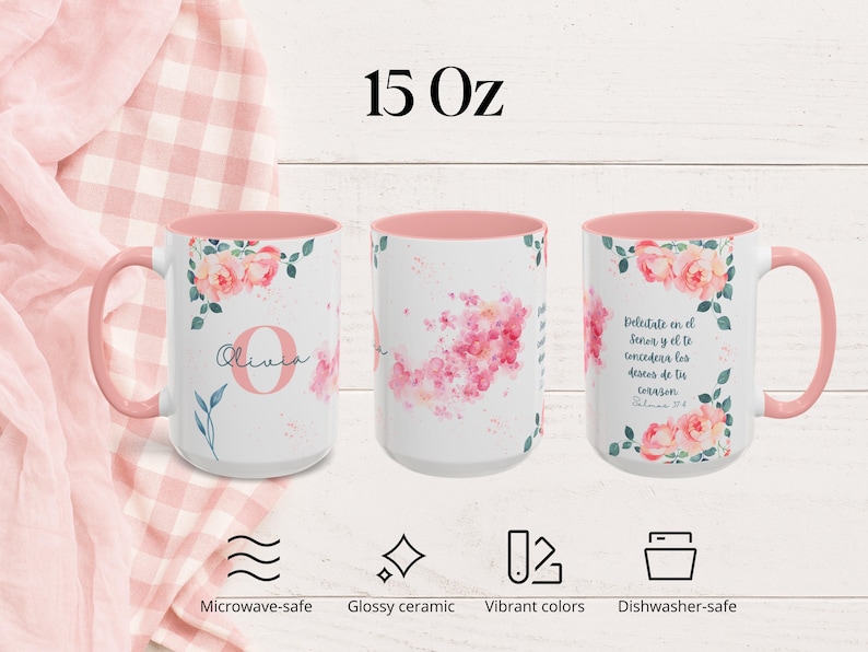 May include: Three white 15 oz ceramic mugs with pink interiors and handles. Each mug features floral designs and text. One mug has the name "Olivia", another has a pink floral design, and the third has Spanish text. The mugs are microwave and dishwasher safe.