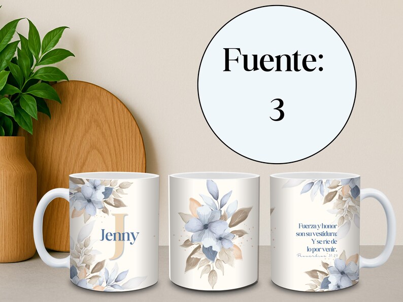 May include: White ceramic mug featuring a floral design with blue and beige accents. The mug has the name "Jenny" and the letter "J" printed on it. The mug also has a quote in Spanish.