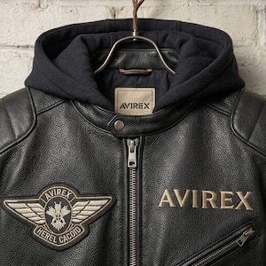 Close up view of zipper and premium stitching on mens handmade black hooded leather biker jacket