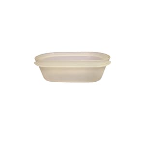 May include: A translucent, off-white, oval-shaped plastic food storage container with a matching lid. The container features a smooth, rounded rim and a slightly tapered base, providing a simple and functional design for storing various food items.