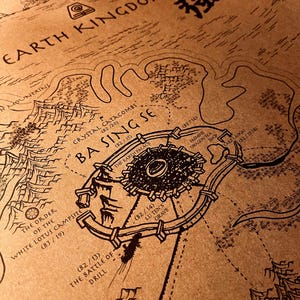 May include: A detailed map of the Earth Kingdom, featuring the city of Ba Sing Se. The map is drawn in black ink on a tan background, with labels like "Crystal Catacombs" and "The Battle of Drill". The map includes the text "Earth Kingdom".