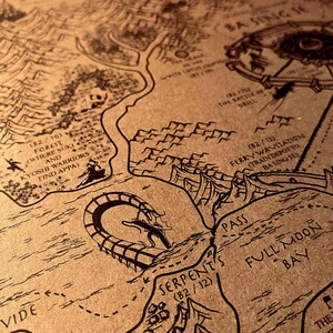 May include: Detailed map illustration in black ink on tan paper. Features geographical elements, text labels, and a stylized serpent. Includes text such as "Serpent's", "Full Moon Bay", and "Ba Sing Se". The map appears to be a fantasy or fictional world.