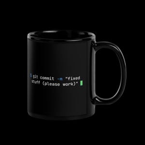 Right handle view of black glossy 11oz coder mug with git commit message — perfect birthday gift for developers and tech professionals.