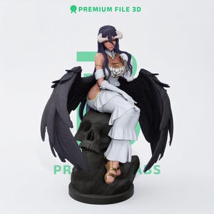 May include: A figurine of a character with long dark hair, curved horns, and large black feathered wings. The figure wears a white dress with gold accents and sits atop a dark skull-shaped base. The text PREMIUM FILE 3D is visible.