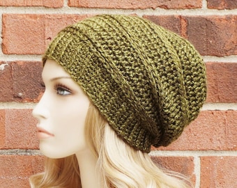 May include: A green crocheted slouchy beanie hat with a ribbed texture.