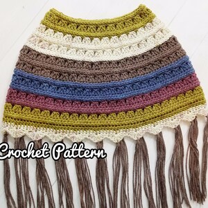 May include: Crochet pattern for a colorful striped poncho with fringe. The poncho is made with a variety of colors, including mustard yellow, brown, blue, and pink. The poncho has a scalloped edge and is finished with a fringe.