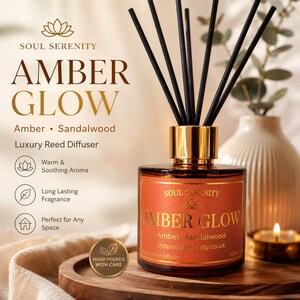 May include: A 100ml amber glass reed diffuser with a gold collar and black reeds. The label reads Soul Serenity Amber Glow, Amber Sandalwood, and shopsoulserenity.co.uk. The product is hand-poured and features a warm, soothing aroma.