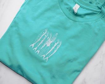 Embroidered Sardines and Girl T-Shirt – Coastal Graphic Tee, Ocean-Inspired Unisex Shirt, Beachy Minimalist Summer Style