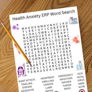 May include: A white paper sheet titled Health Anxiety ERP Word Search featuring a grid of letters, a list of medical terms, and colorful illustrations of viruses, a hospital, a patient, and medical equipment, with a yellow pencil resting on top.
