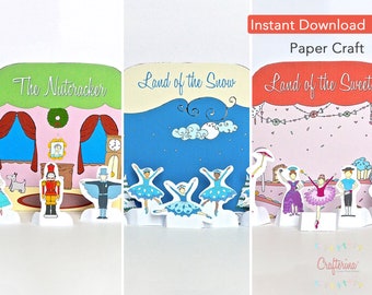 May include: Three printable paper craft scenes featuring the Nutcracker, Land of the Snow, and Land of the Sweets. Each scene includes characters and a backdrop for a fun and interactive craft project.