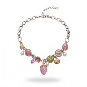 May include: Silver-toned necklace with pink, green, and gold charms. The charms include flowers, a strawberry, a seashell, and faux pearls. The necklace has a lobster clasp closure and is set against a white background.