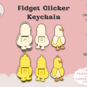 May include: Fidget Clicker Keychain digital download featuring 3D models of a duck wearing a banana peel. Includes a concealed bead chain slot, keychain version, and 3MF and STL files. The design shows a duck in a banana suit in both cream and yellow color variations with a clicker mechanism.