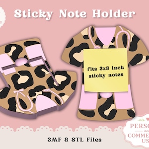 May include: Two decorative sticky note holders in the shape of a medical uniform. One is a side view, the other is a front view. Both have a tan leopard print with black spots and pink accents. The front view holds a 3x3 inch sticky note.