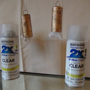 May include: Two cans of Rust-Oleum Painters Touch 2X Ultra Cover clear spray paint. One can is gloss and the other is matte.