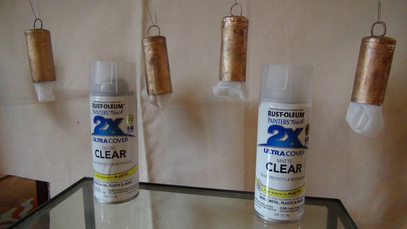 May include: Two cans of Rust-Oleum Painters Touch 2X Ultra Cover clear spray paint. One can is gloss and the other is matte.