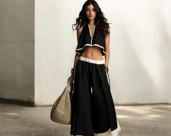 Conjunto bohemio de dos piezas: pantalones anchos y fluidos y top corto. Atuendo elegante para festivales de verano y estilo bohemio.