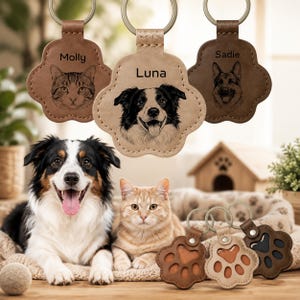 May include: Three paw-shaped leather keychains featuring engraved pet portraits and names Molly, Luna, and Sadie. Below, a dog and a cat sit near three additional paw-shaped keychains with cut-out details. The keychains are made of brown and tan leather.