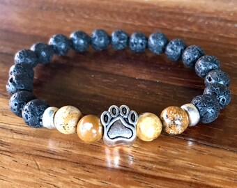 Picture jasper and lava stone gemstone stretch bracelet with dog paw center bead.