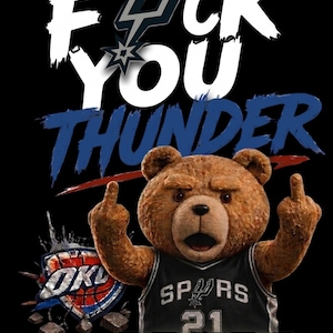 May include: A digital graphic featuring a brown teddy bear wearing a black and white Spurs jersey, giving the middle finger. The text "FUCK YOU THUNDER" is displayed above the bear, with the Oklahoma City Thunder logo on the left.