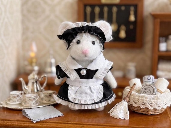 A 4.5" needle-felted mouse dressed as a French maid — absurdly specific, skillfully sculpted soft sculpture that exists nowhere else on Earth.