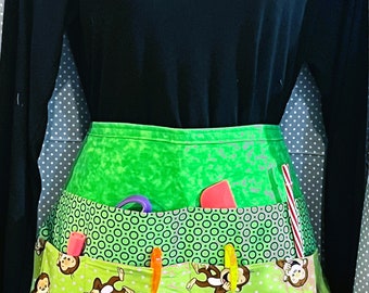 100% Cotton Teachers, Utility, Crafters Waist Half Apron with 6 Pockets and long ties. One size fits most.