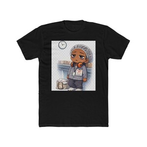 May include: Black t-shirt featuring a cartoon illustration of a tired worker. The character wears a hair net, headphones, and a name tag that reads "Just 998". A clock is visible in the background. The worker is leaning against a conveyor belt.