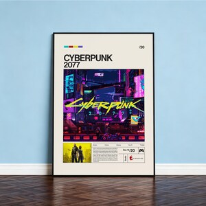 May include: A framed poster for the video game Cyberpunk 2077. The poster features a vibrant, neon-lit cityscape with the game's title in large, stylized lettering. Additional text includes the date "Dec 10/20" and the studio's name.