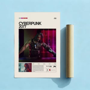 May include: A Cyberpunk 2077 poster featuring a character with long hair and a futuristic outfit. The poster has a beige background with the game title in black. A rolled-up poster is next to the poster on a blue surface.