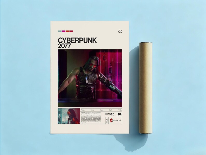 May include: A Cyberpunk 2077 poster featuring a character with long hair and a futuristic outfit. The poster has a beige background with the game title in black. A rolled-up poster is next to the poster on a blue surface.