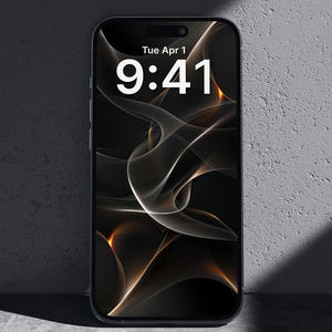 May include: A black smartphone displays a digital wallpaper with a swirling, abstract design in shades of black, white, and gold. The time, 9:41, and date, Tue Apr 1, are visible on the screen.