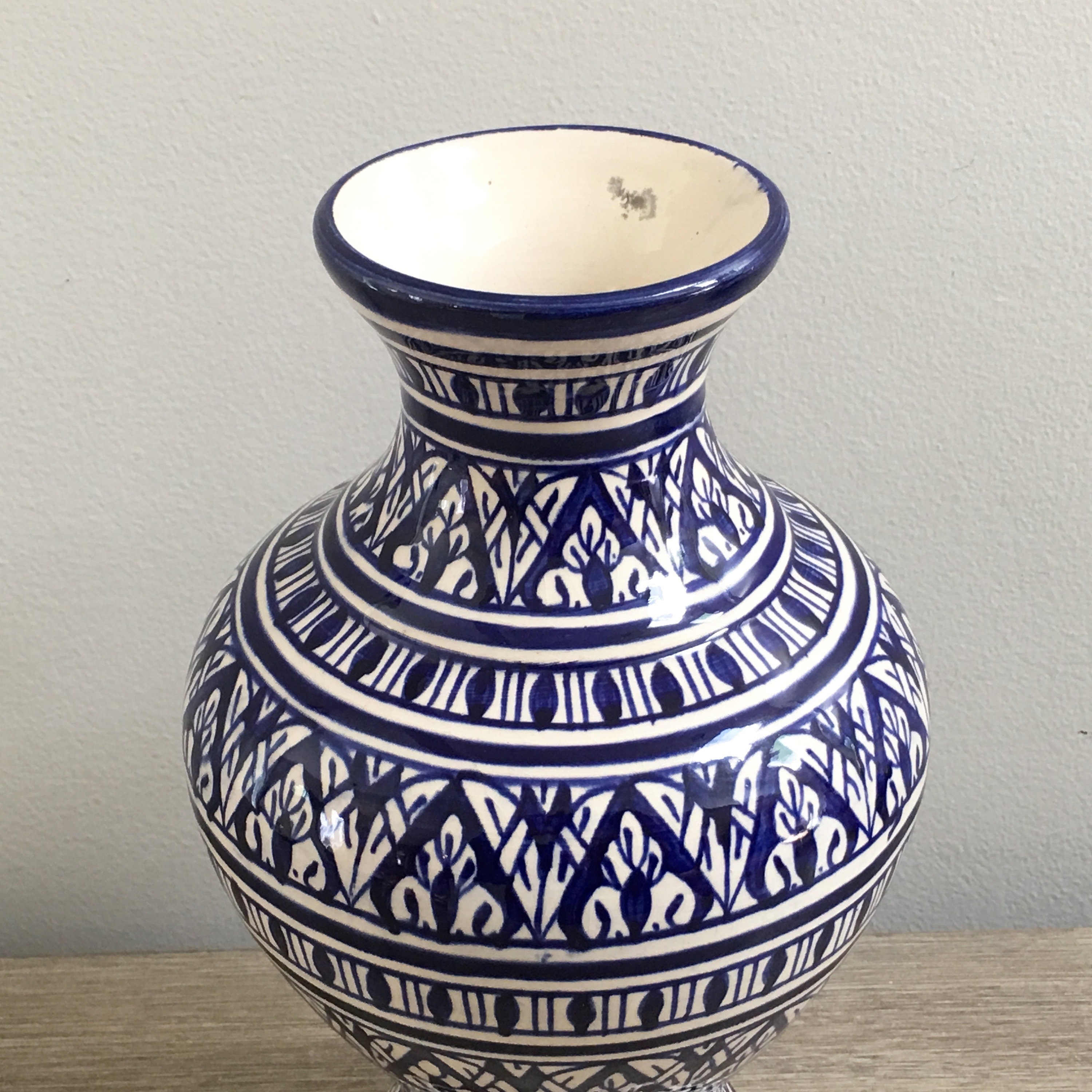 blue pottery with white figures