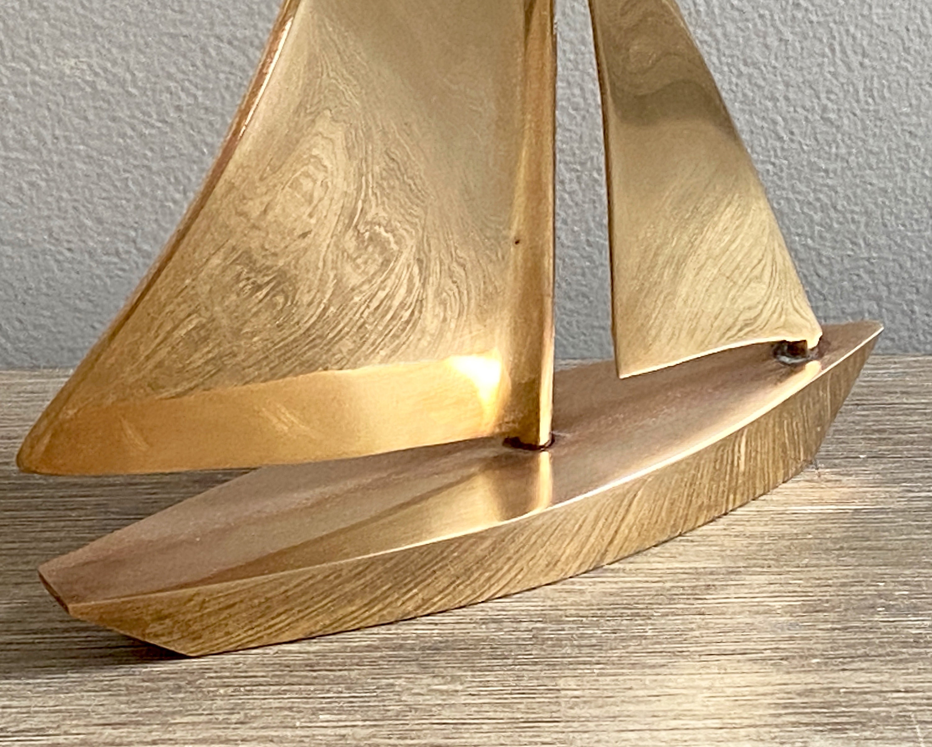 brass sailboat statues