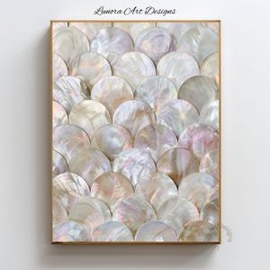 May include: A rectangular wall art piece featuring a repeating pattern of overlapping circular mother-of-pearl shell segments in iridescent white, cream, and soft pink tones, framed in a thin gold border with the text Lunora Art Designs above.