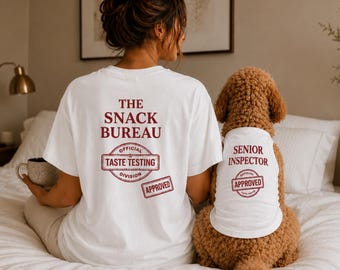 May include: A white t-shirt with red text reading THE SNACK BUREAU OFFICIAL TASTE TESTING DIVISION APPROVED and a matching white pet tank top with red text reading SENIOR INSPECTOR OFFICIAL APPROVED, both featuring a stamp-like graphic design.