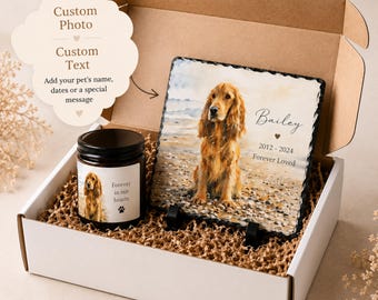 May include: A gift box containing a square slate plaque and a candle. The slate features a watercolor-style image of a golden spaniel on a beach with the text Bailey, 2012-2024, Forever Loved. The candle has a label with the same dog and text.