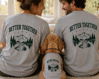 May include: Two grey short-sleeved t-shirts and one matching grey pet tank top, each featuring a dark green graphic print on the back. The design includes the text BETTER TOGETHER above a mountain range, pine trees, and a winding river scene.
