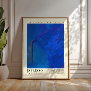 May include: A framed art print featuring a blue and brown espresso coffee design. The artwork includes the text "SAPORI D'ITALIA" at the top and "ESPRESSO CAFFÈ" at the bottom. The image has a vintage aesthetic.