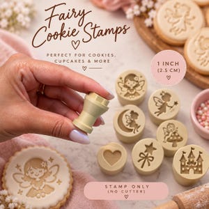May include: A set of light beige cookie stamps featuring fairy, heart, star, and castle designs. Each stamp measures 1 inch in diameter. The text on the image reads Fairy Cookie Stamps, Perfect for cookies, cupcakes & more, and Stamp only (no cutter).