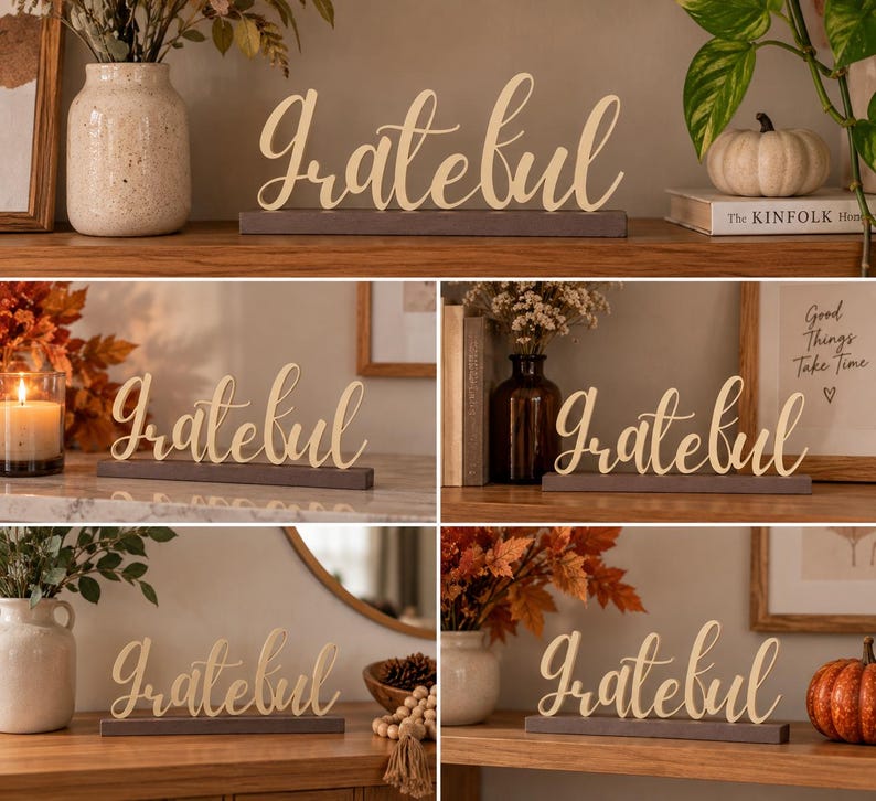 May include: A decorative tabletop sign featuring the word Grateful in a gold-colored cursive script font. The lettering is mounted on a rectangular dark gray base. The sign is shown in multiple settings with various seasonal home decor items.