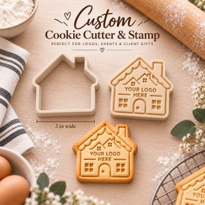 May include: A beige house-shaped cookie cutter and a matching stamp, both 3 inches wide. The stamp features a house design with windows, a door, and the text 'YOUR LOGO HERE'. A baked cookie with the same house design is also shown.